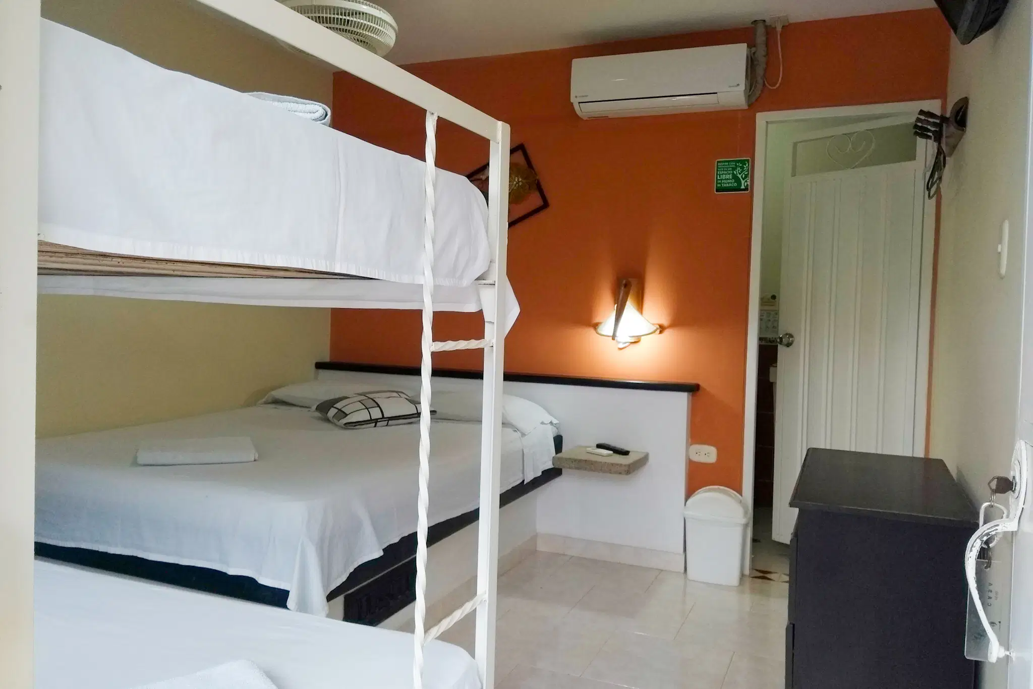 Room with a double bed and bunk bed